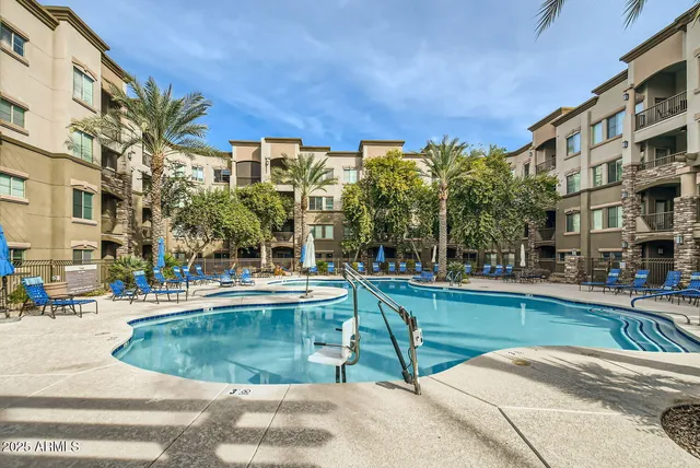 a view of a swimming pool with a patio