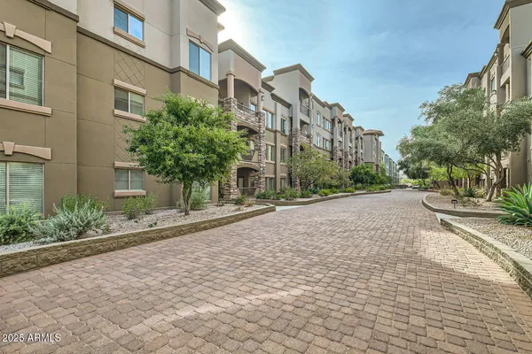 a view of a street with a building in the background