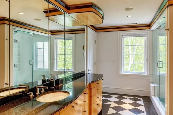 a bathroom with a sink mirror and a bathtub