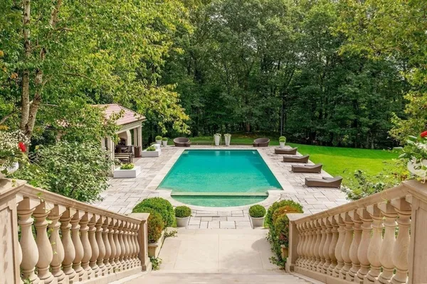 a view of a patio with chairs and a yard