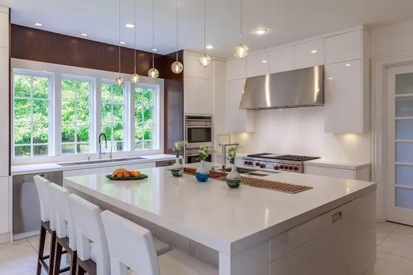 a kitchen with a stove a sink and a refrigerator