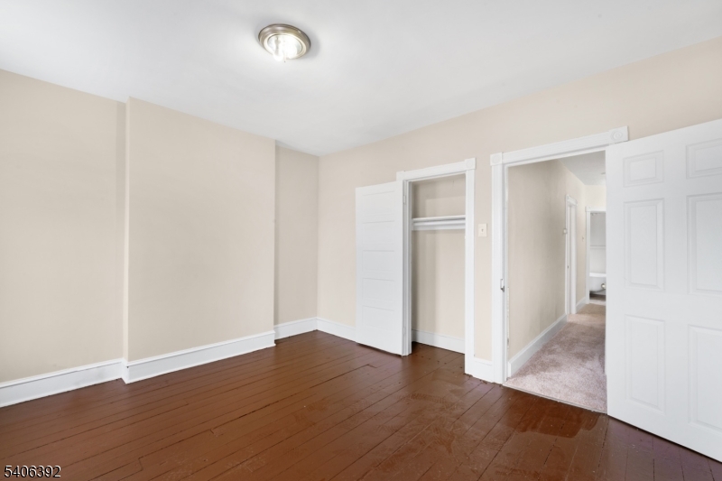 21 Short Street Trenton, NJ 08618 - Photo 11 of 22 a view of an empty room with wooden floor