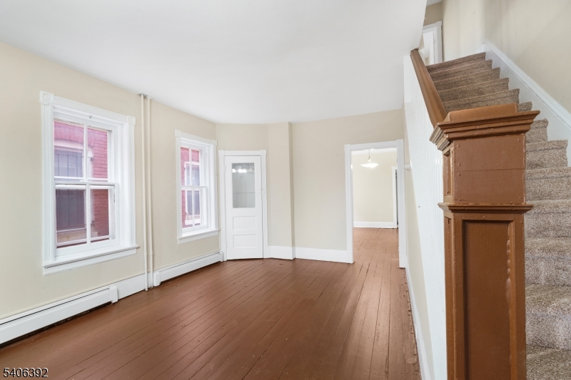 21 Short Street Trenton, NJ 08618 - Photo 14 of 22 a view of livingroom with furniture and wooden floor
