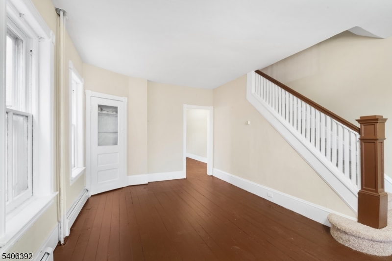 21 Short Street Trenton, NJ 08618 - Photo 17 of 22 a view of an empty room with wooden floor