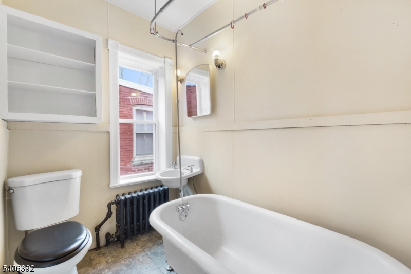 21 Short Street Trenton, NJ 08618 - Photo 21 of 22 a bathroom with a bathtub and toilet