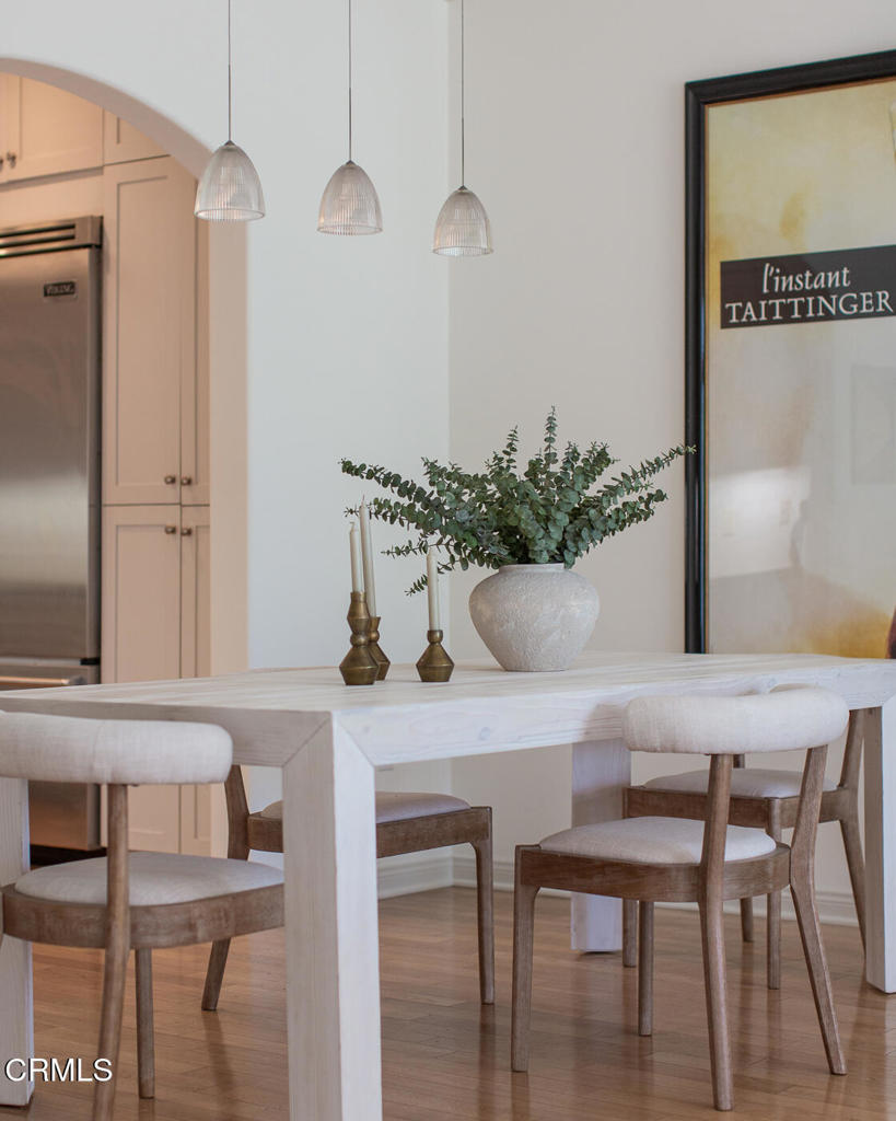 700 Union Street, Unit 302 Pasadena, CA 91101 - Photo 11 of 30 a view of a dining room with furniture and wooden floor