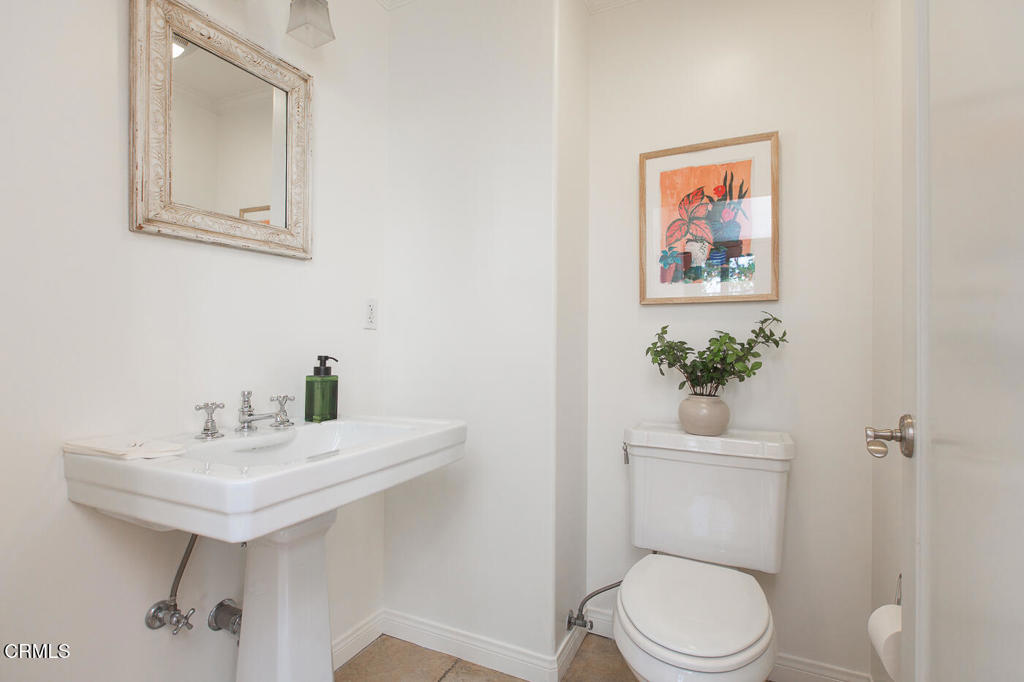 700 Union Street, Unit 302 Pasadena, CA 91101 - Photo 16 of 30 a bathroom with a toilet a sink and mirror