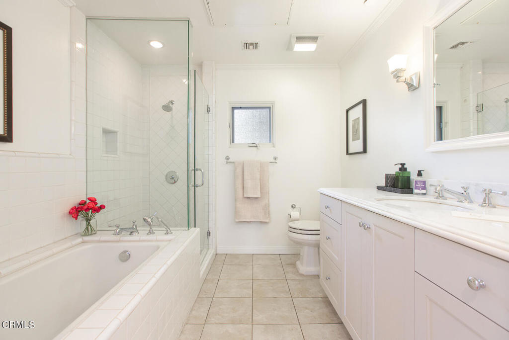 700 Union Street, Unit 302 Pasadena, CA 91101 - Photo 21 of 30 a spacious bathroom with a tub sink mirror and toilet