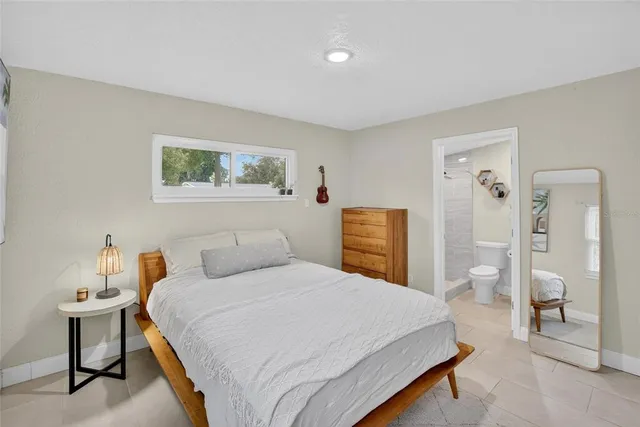 a bedroom with a bed and closet