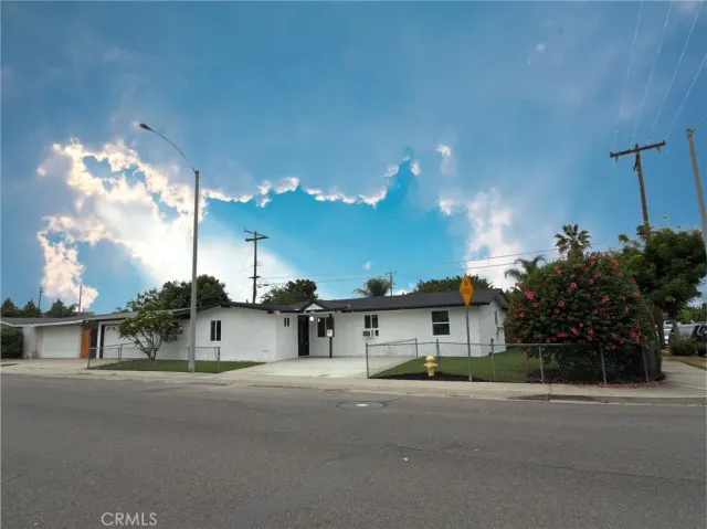 a view of a house with a street