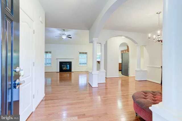 a view of a livingroom with furniture window and wooden floor