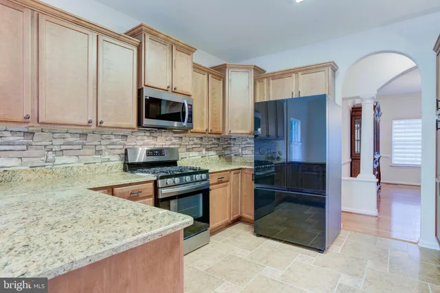 a view of a dining room with furniture and window