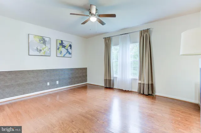 a spacious bathroom with a granite countertop sink and a mirror