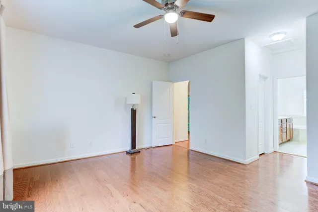 a bathroom with a sink mirror vanity and toilet
