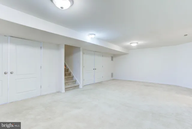 an empty room with a fan