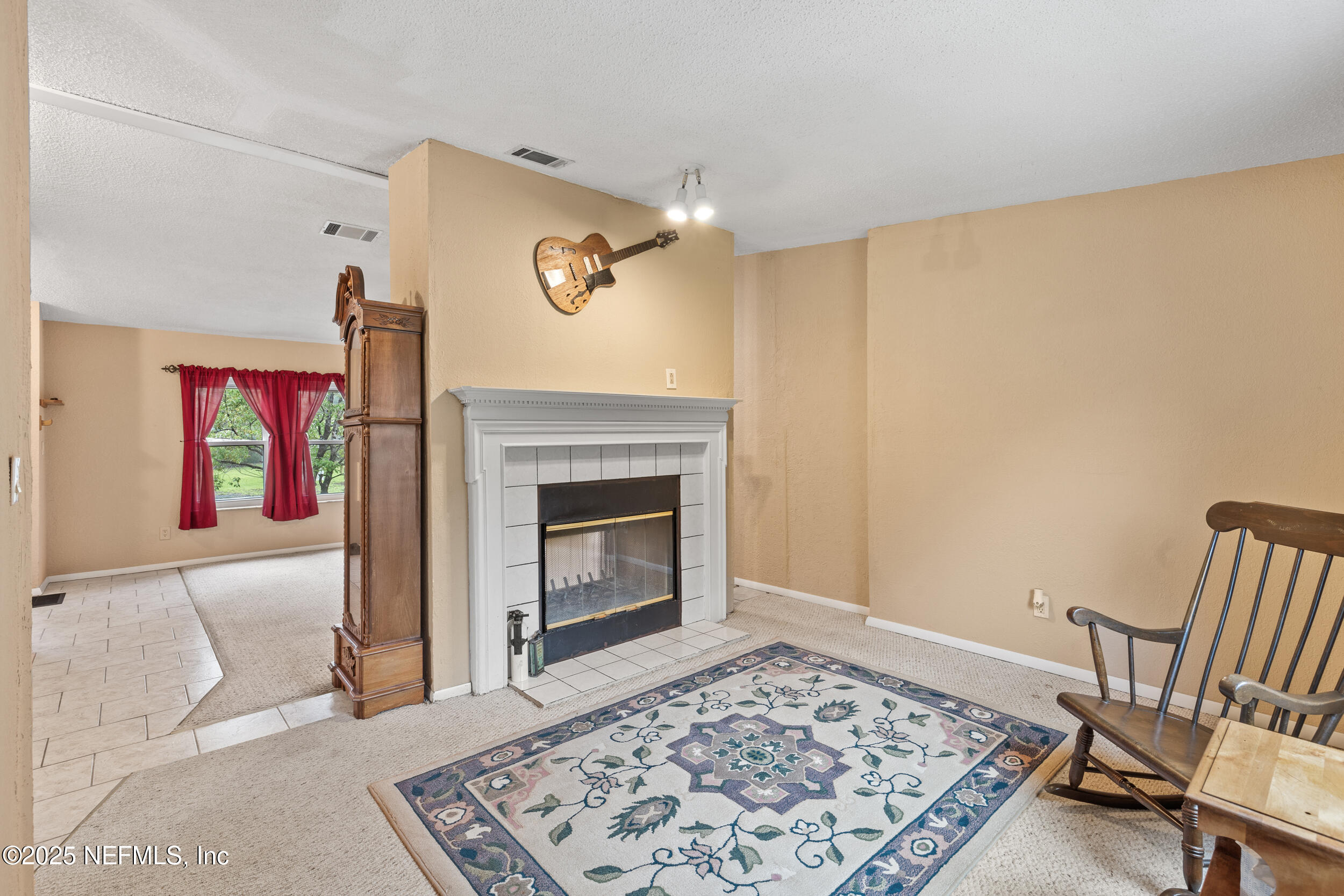 5671 Chugah Street Keystone Heights, FL 32656 - Photo 15 of 47 a living room with furniture and a fireplace