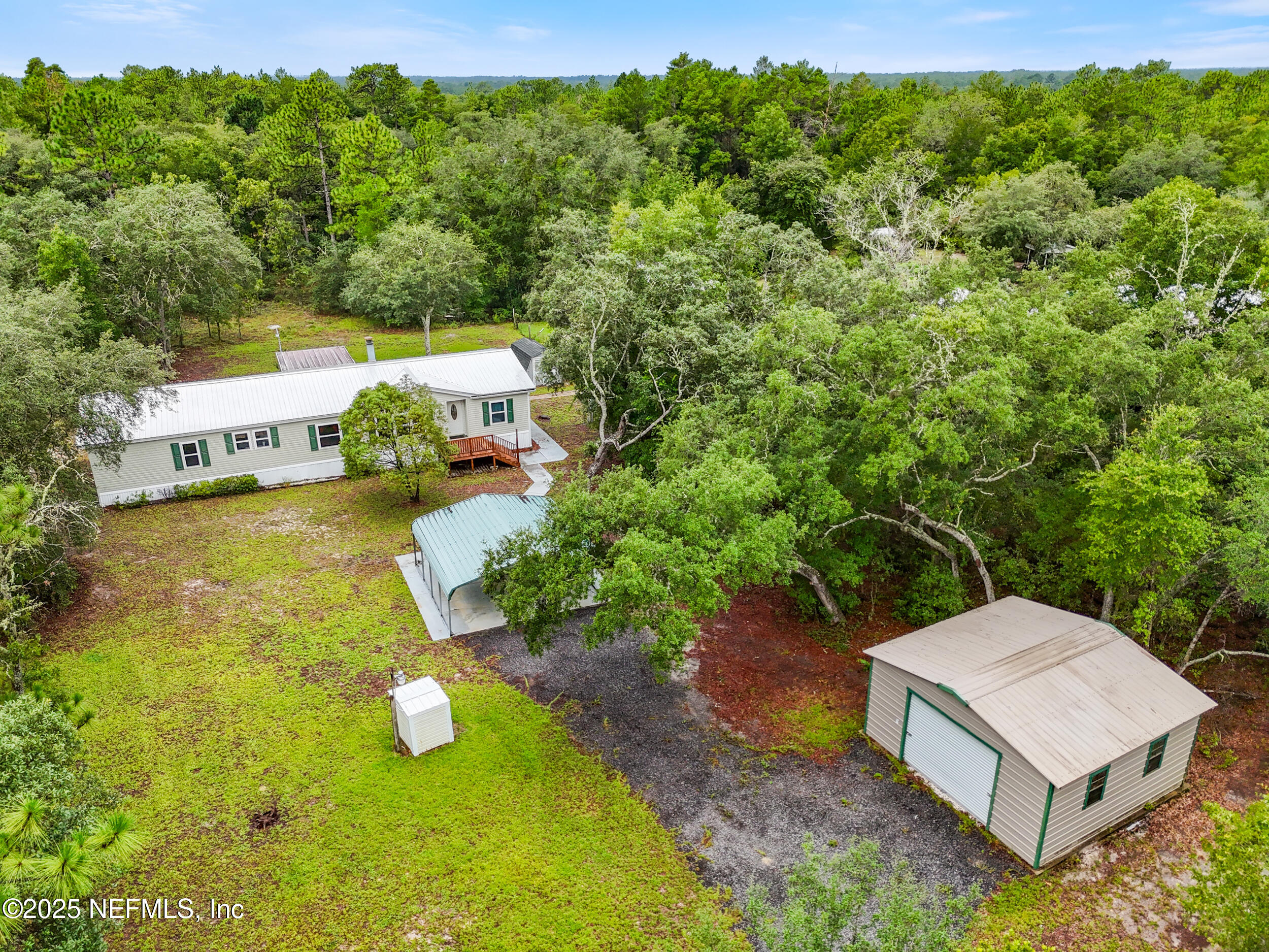 5671 Chugah Street Keystone Heights, FL 32656 - Photo 2 of 47 a view of a house with a yard and lake view