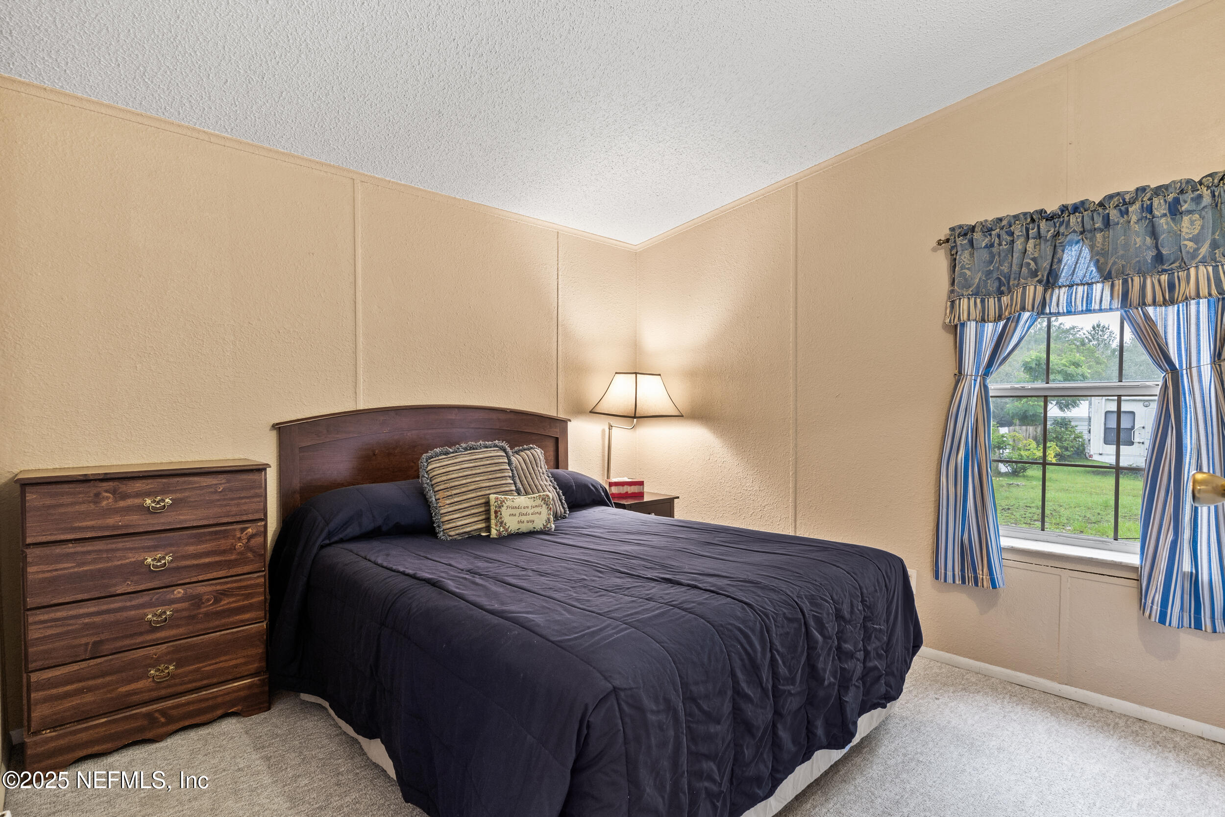5671 Chugah Street Keystone Heights, FL 32656 - Photo 25 of 47 a bedroom with a bed and a window