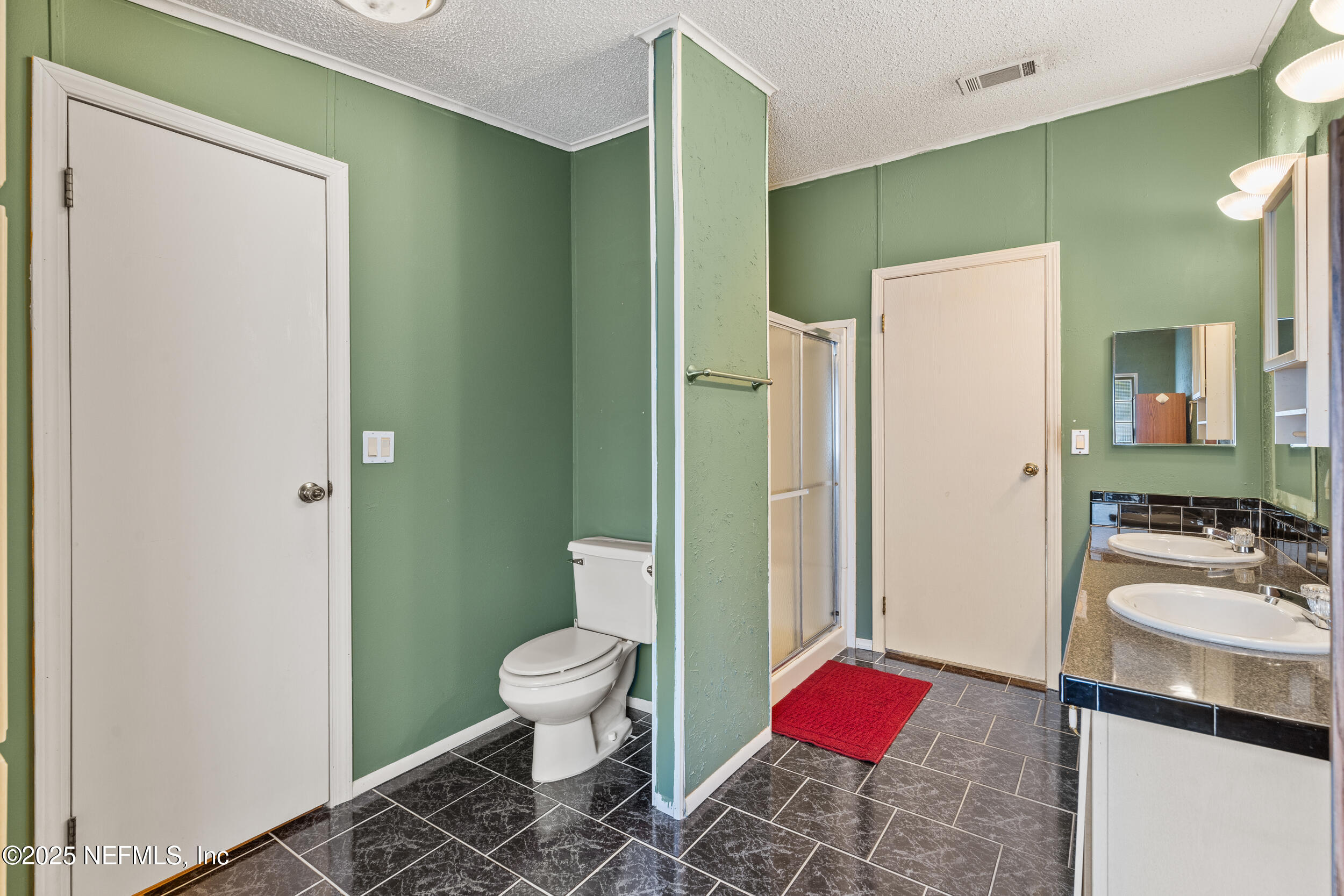 5671 Chugah Street Keystone Heights, FL 32656 - Photo 31 of 47 a bathroom with a sink toilet and shower