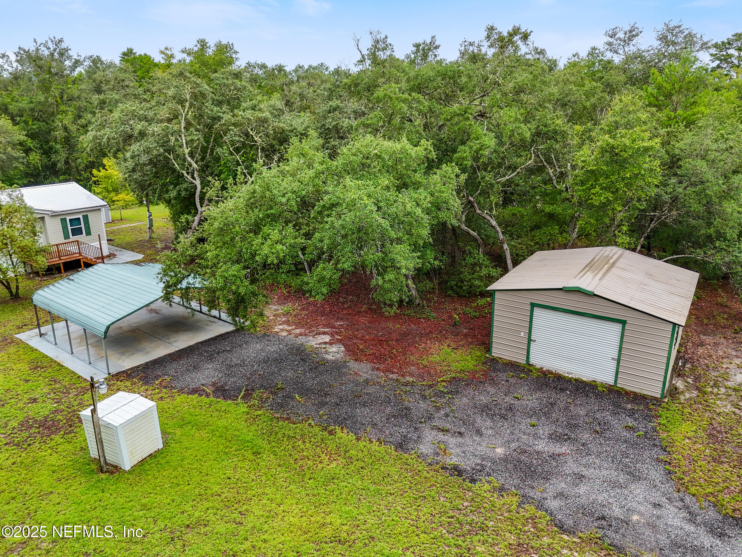 5671 Chugah Street Keystone Heights, FL 32656 - Photo 4 of 47 a view of a house with a yard and sitting area