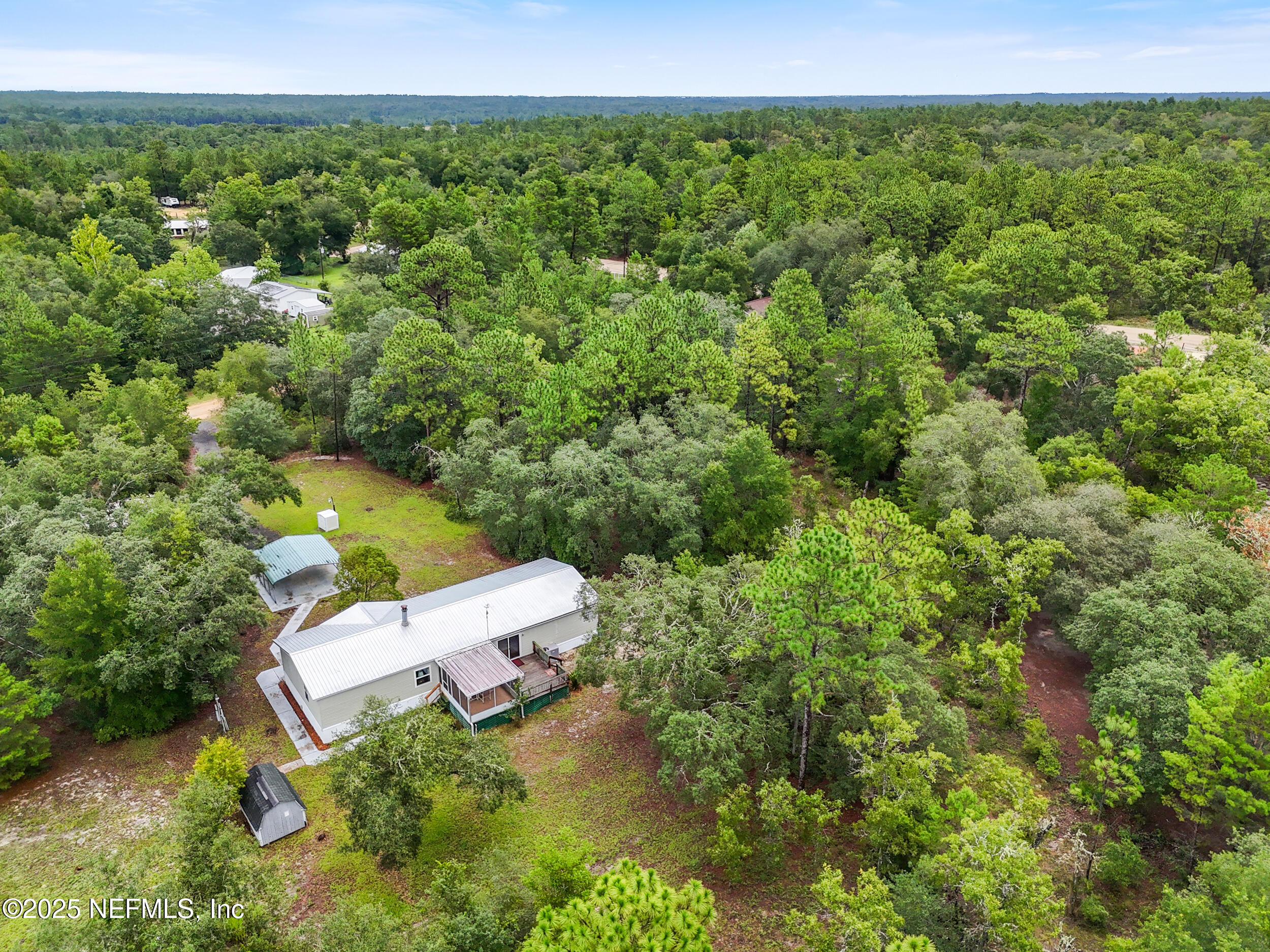 5671 Chugah Street Keystone Heights, FL 32656 - Photo 42 of 47 an aerial view of a house with a yard