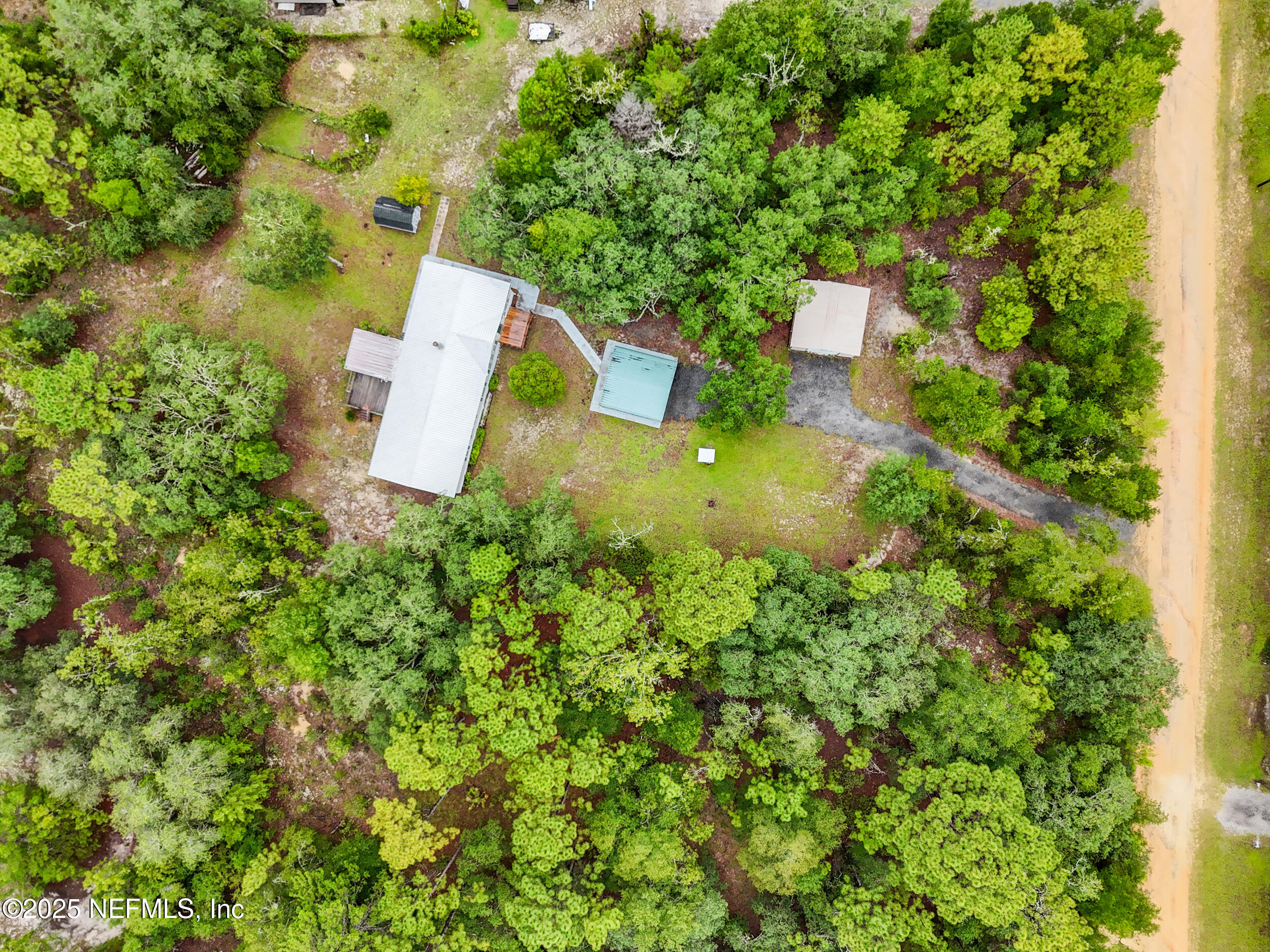 5671 Chugah Street Keystone Heights, FL 32656 - Photo 43 of 47 an aerial view of a house with swimming pool and garden