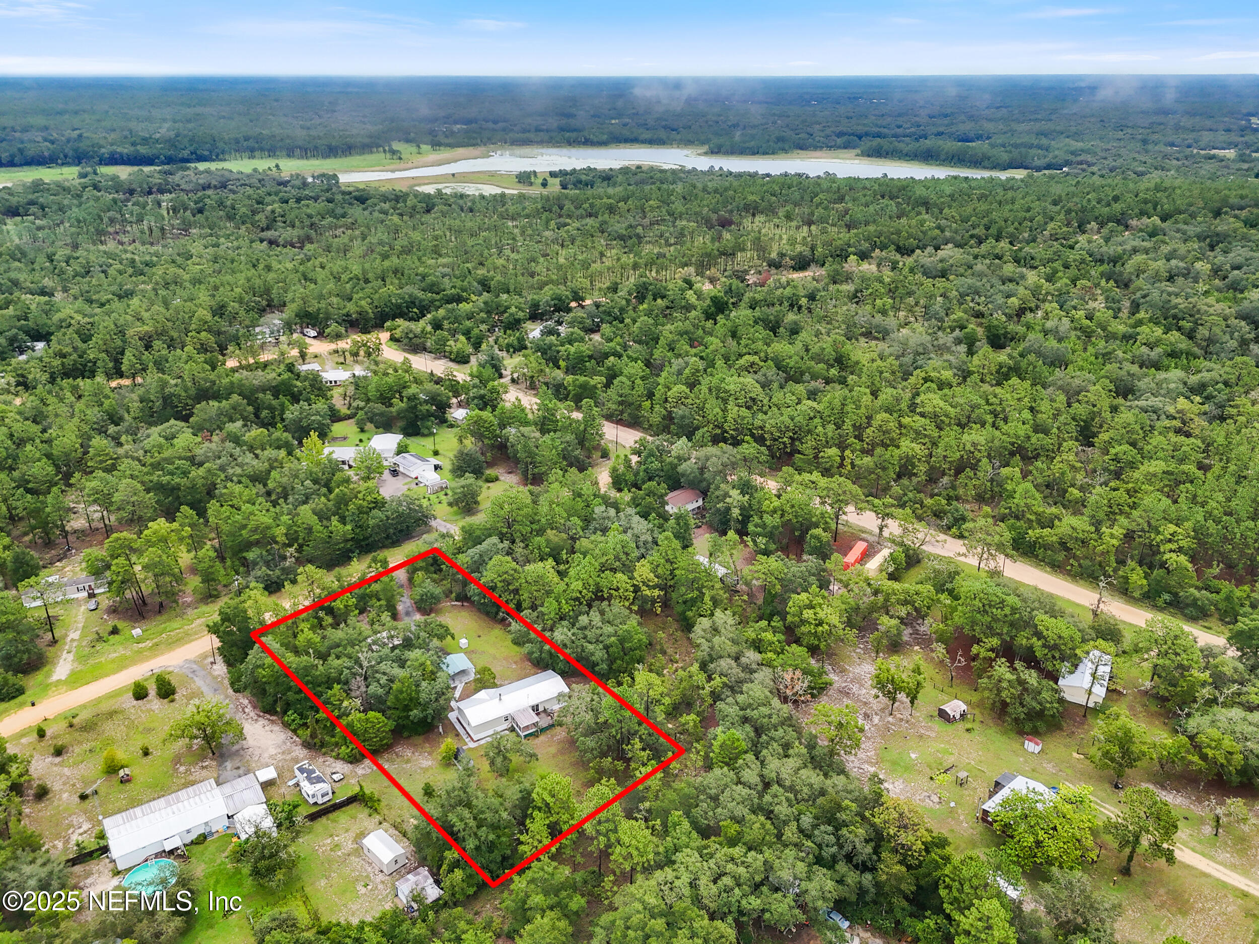 5671 Chugah Street Keystone Heights, FL 32656 - Photo 47 of 47 a view of an outdoor space and a yard