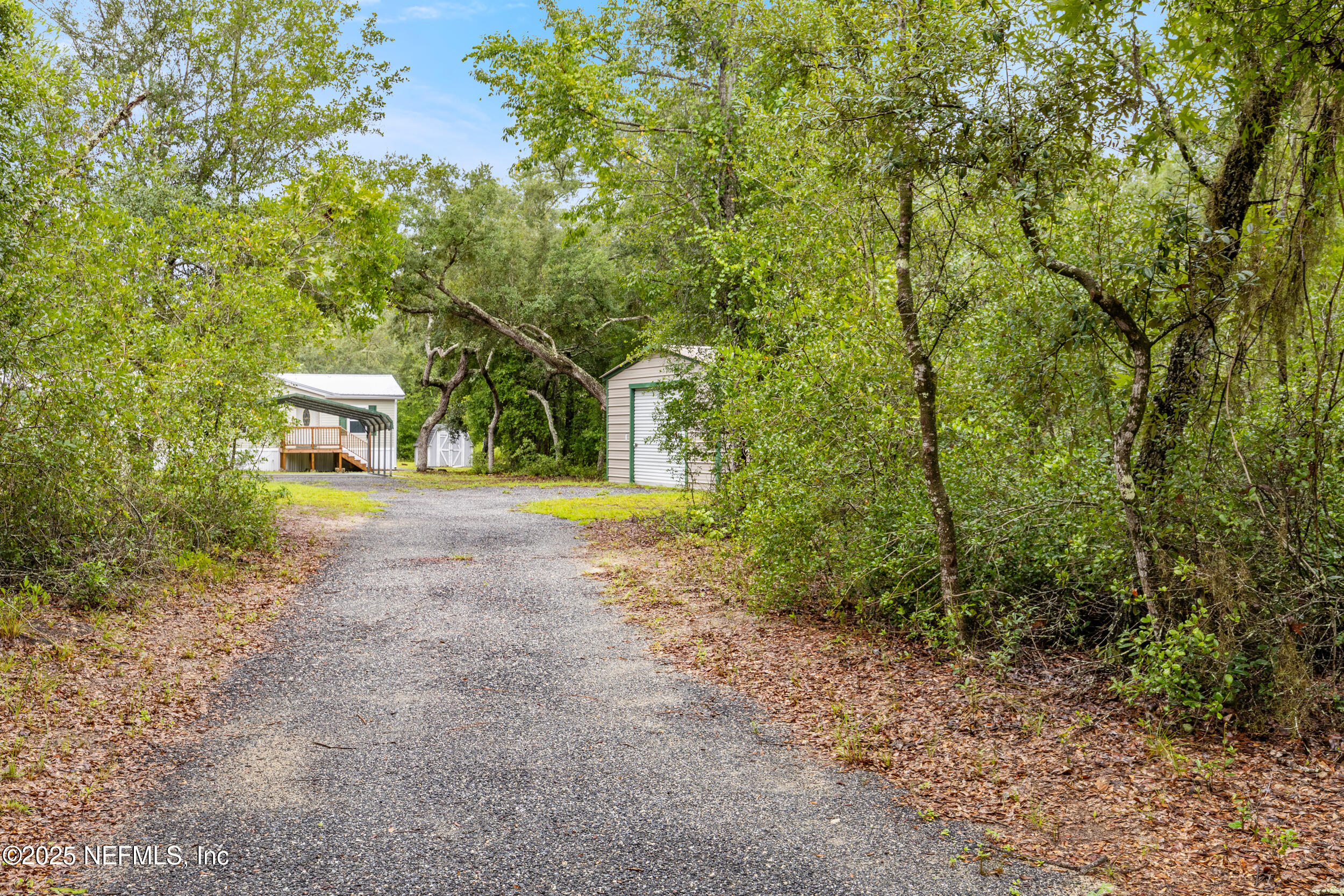 5671 Chugah Street Keystone Heights, FL 32656 - Photo 6 of 47 a view of a house with a yard and sitting area