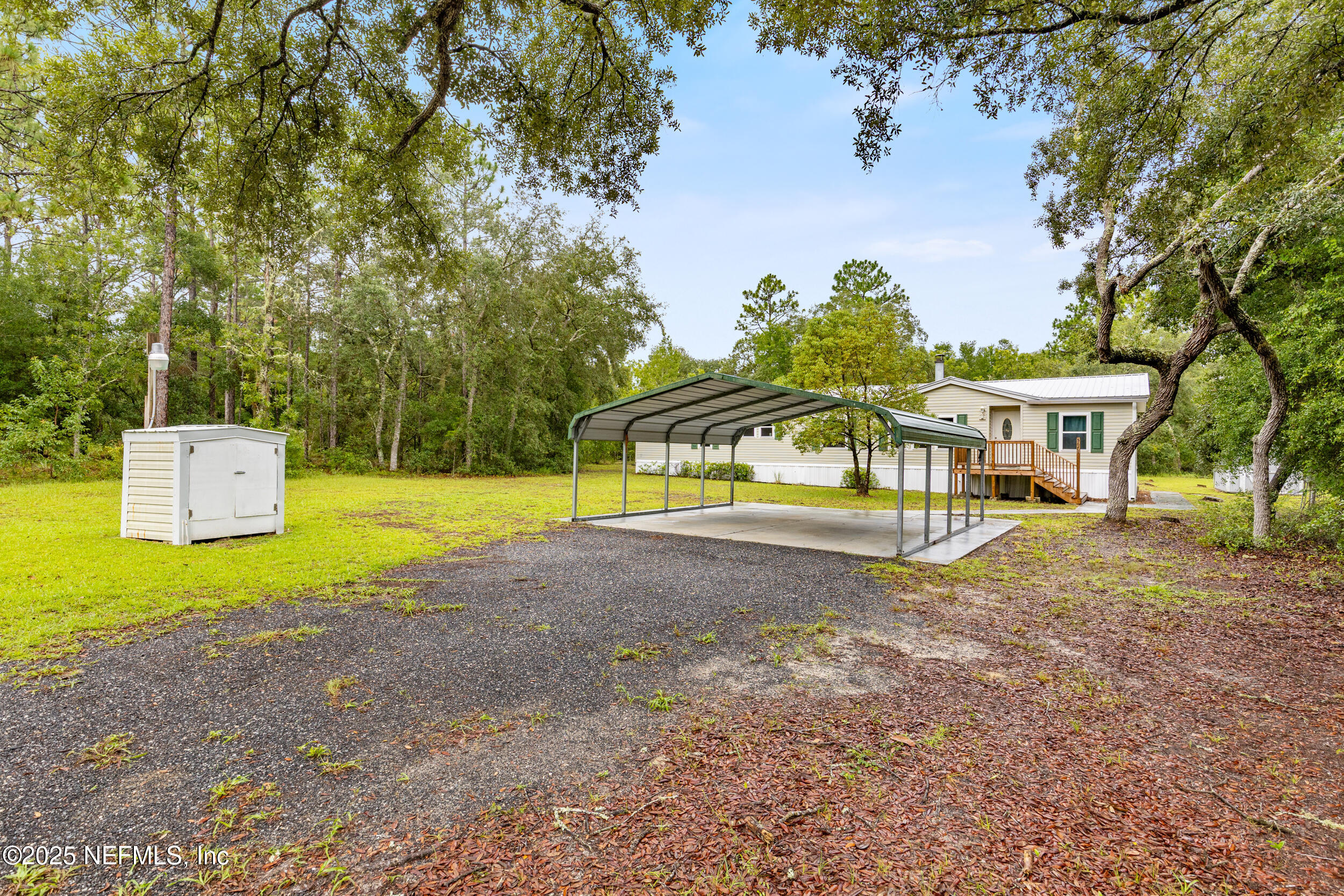 5671 Chugah Street Keystone Heights, FL 32656 - Photo 8 of 47 a view of a house with pool and a yard