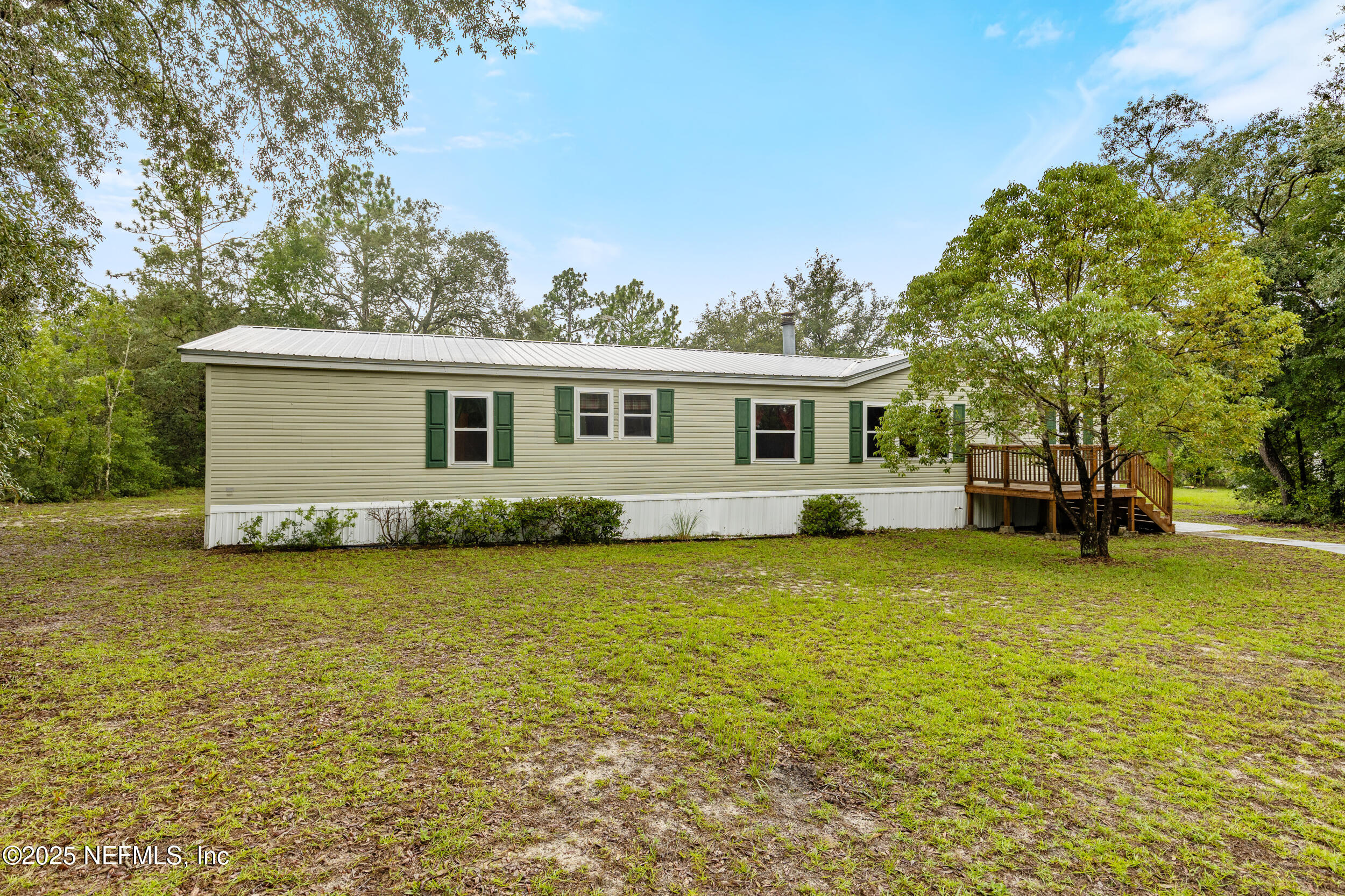 5671 Chugah Street Keystone Heights, FL 32656 - Photo 9 of 47 a view of a house with a patio