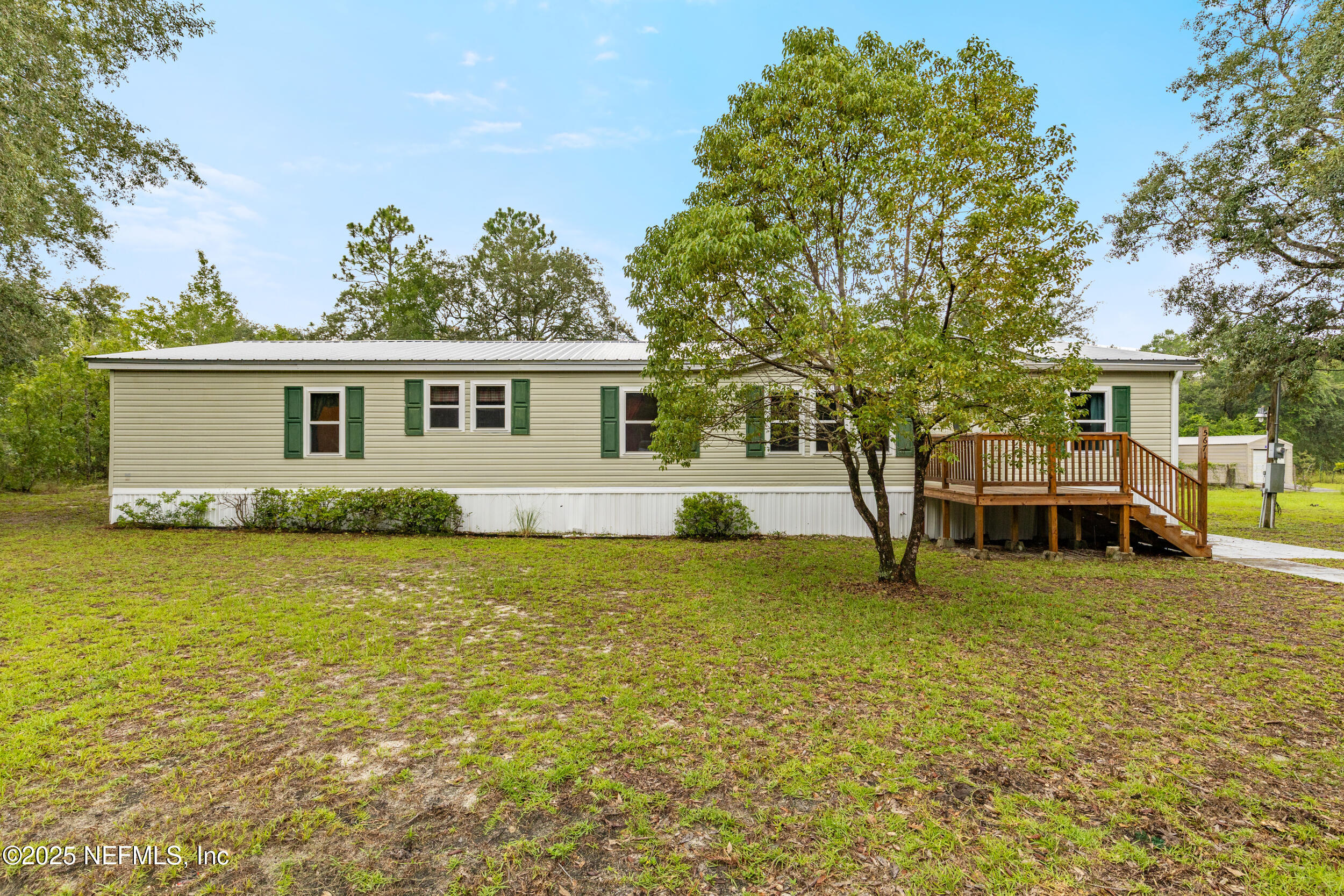 5671 Chugah Street Keystone Heights, FL 32656 - Photo 10 of 47 a view of a house with a yard