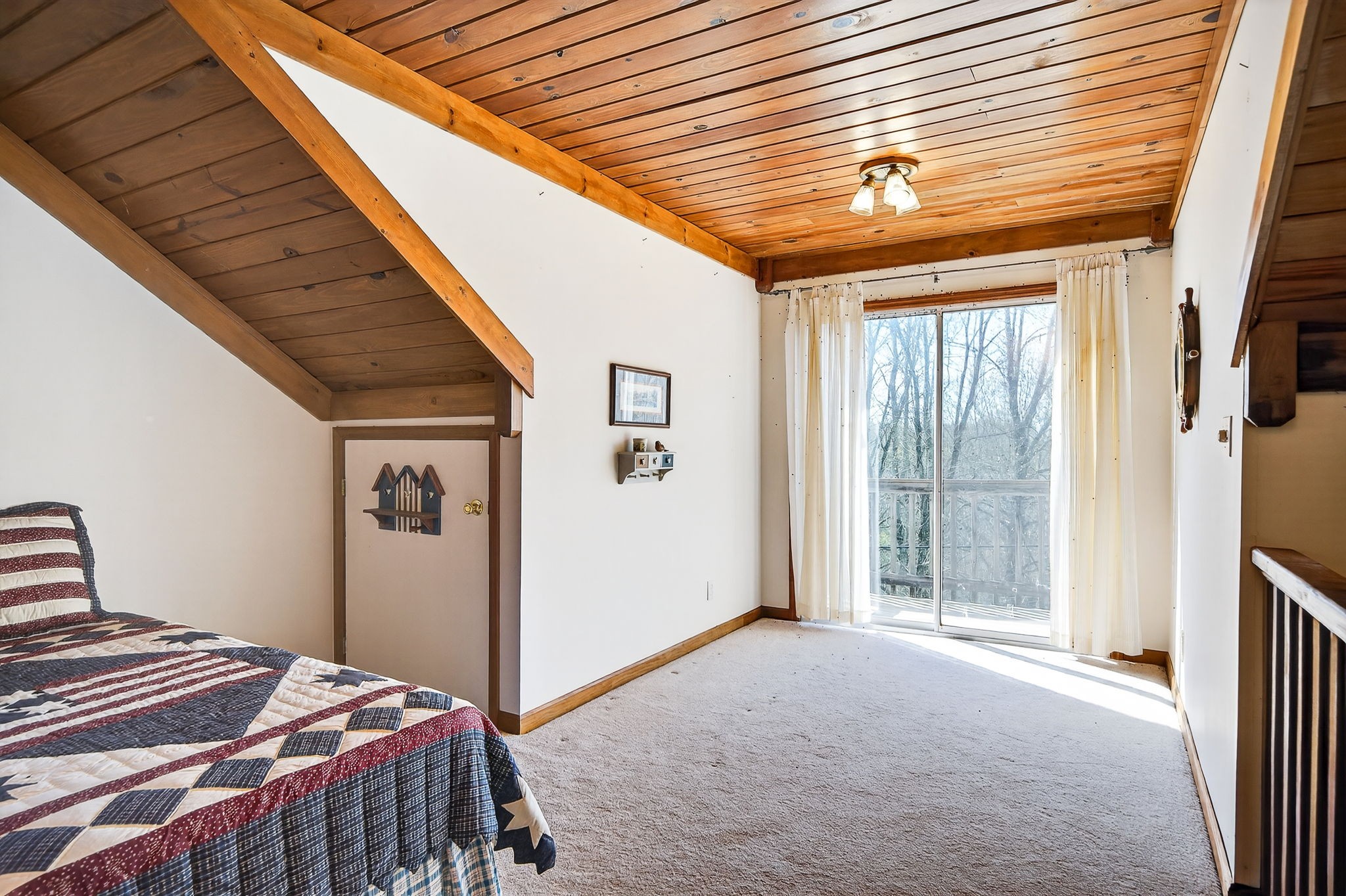 676 Sunny Point Road Baxter, TN 38544 - Photo 19 of 35 a bedroom with a bed and a window