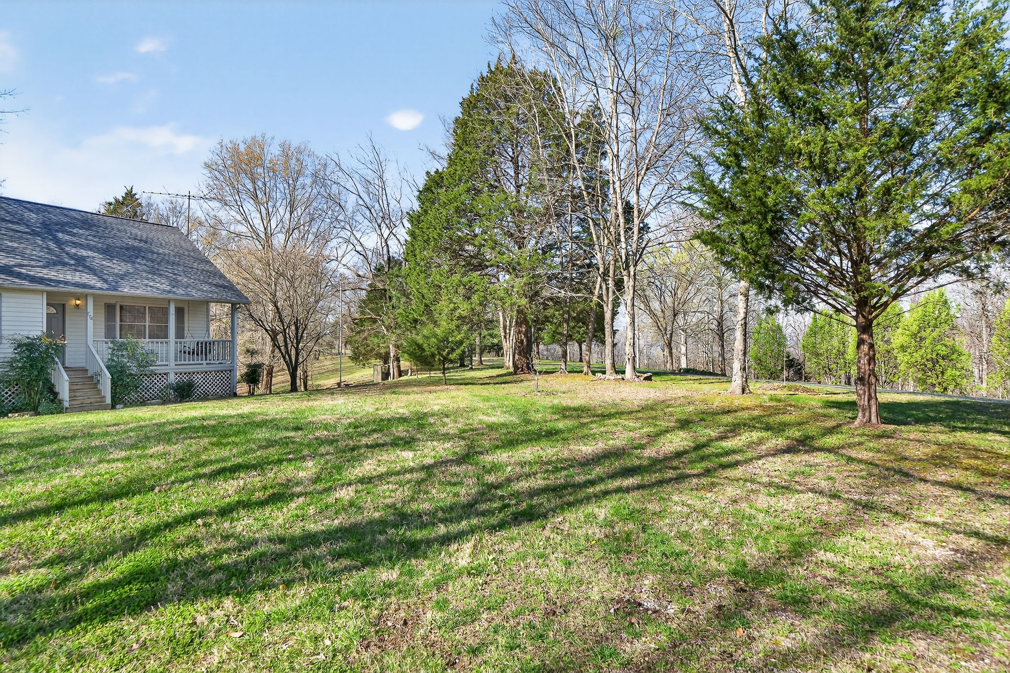 676 Sunny Point Road Baxter, TN 38544 - Photo 24 of 35 a view of a house with a yard