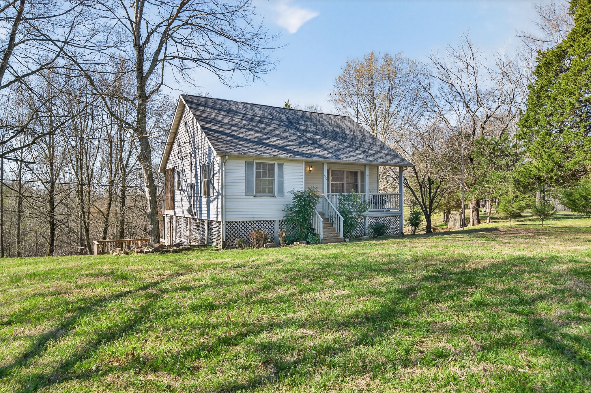 676 Sunny Point Road Baxter, TN 38544 - Photo 25 of 35 a house view with a garden space