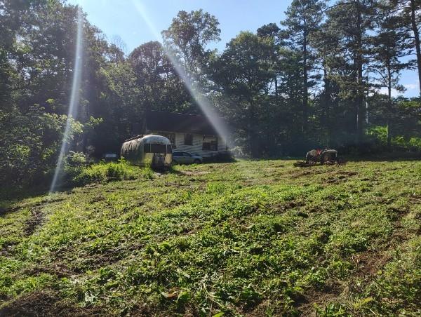 3403 Glenwood Road Decatur, GA 30032 - Photo 23 of 27 a blue swimming pool is sitting in the middle of a yard