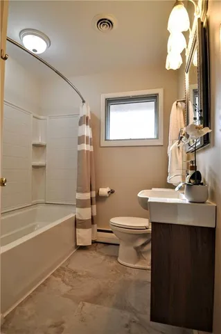 a bathroom with a sink a toilet and a bathtub