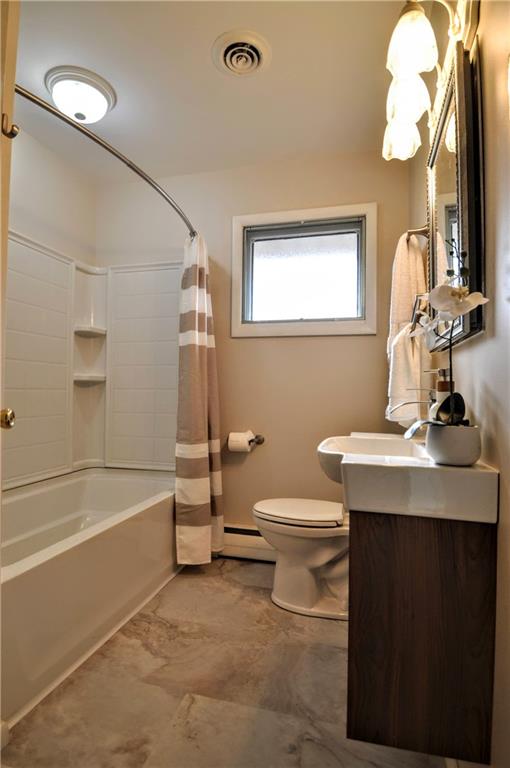 1168 Elm Street Monaca, PA 15061 - Photo 19 of 48 a bathroom with a sink a toilet and a bathtub