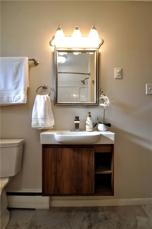 1168 Elm Street Monaca, PA 15061 - Photo 20 of 48 a bathroom with a sink and a mirror