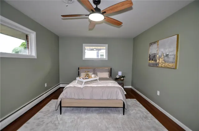 a bedroom with bed and window