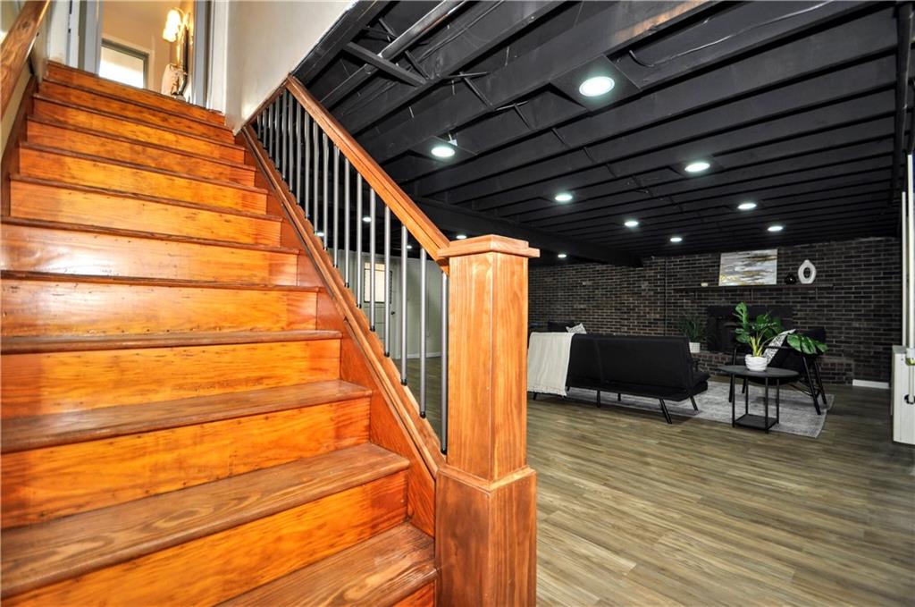 1168 Elm Street Monaca, PA 15061 - Photo 27 of 48 a view of a patio with table and chairs with wooden floor and fence