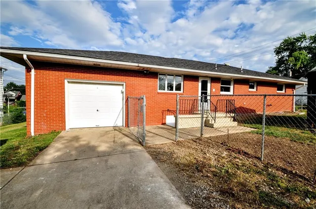 swimming pool view with a garden