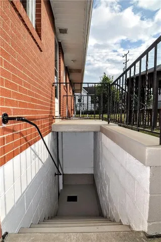 a view of a swimming pool with outdoor seating