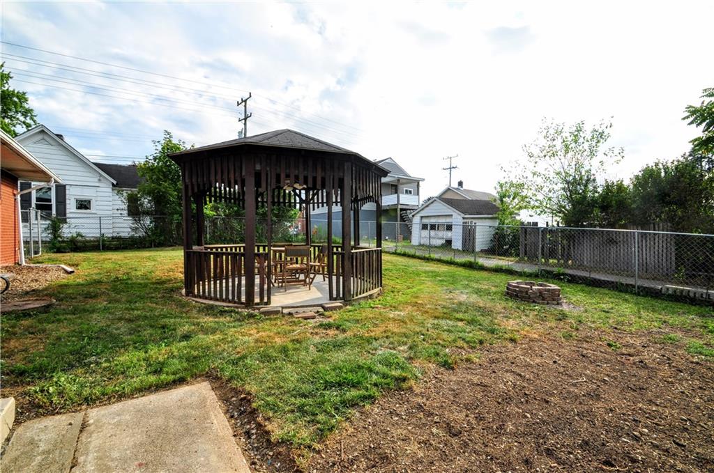 1168 Elm Street Monaca, PA 15061 - Photo 47 of 48 a view of a house with backyard and a slide
