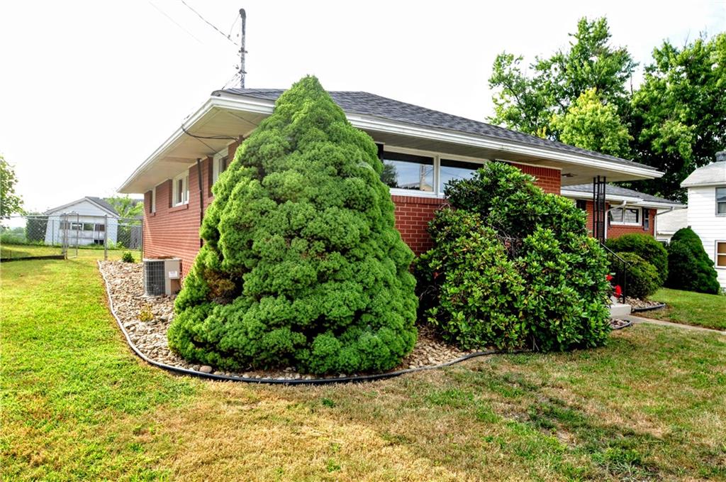 1168 Elm Street Monaca, PA 15061 - Photo 5 of 48 a front view of a house with a yard