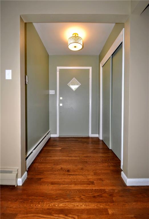 1168 Elm Street Monaca, PA 15061 - Photo 9 of 48 a view of an empty room with wooden floor and a window