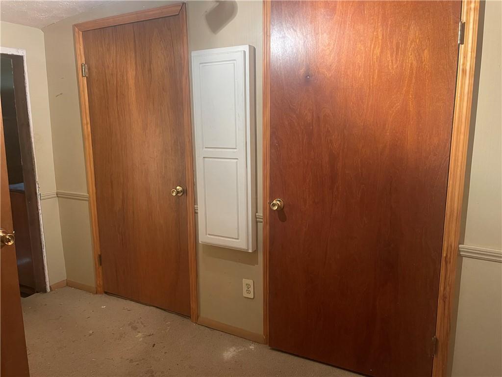 617 Fullingmill Road Mercer, PA 16137 - Photo 17 of 18 Hallway closet with Built in Ironing Board