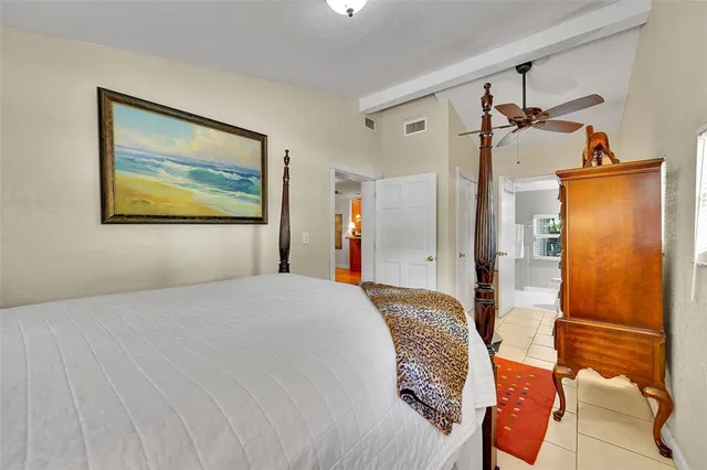 a kitchen with sink and mirror