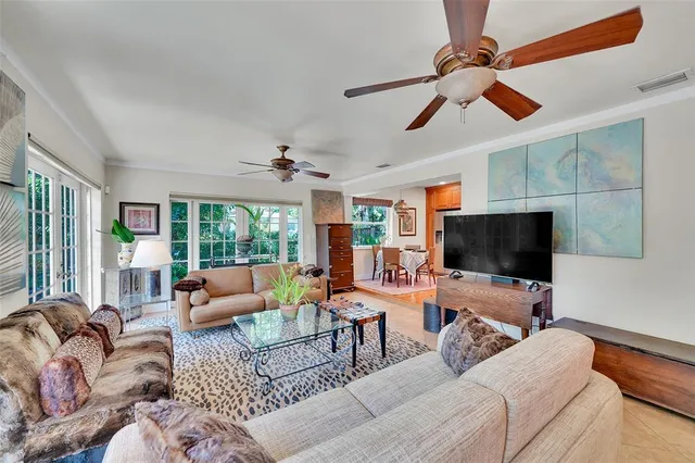 a view of a house with backyard porch and sitting area