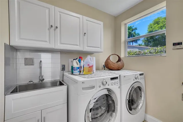 a view of a house with backyard porch and sitting area