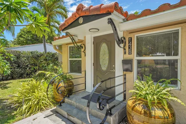 a view of a dining room and livingroom with furniture wooden floor a chandelier